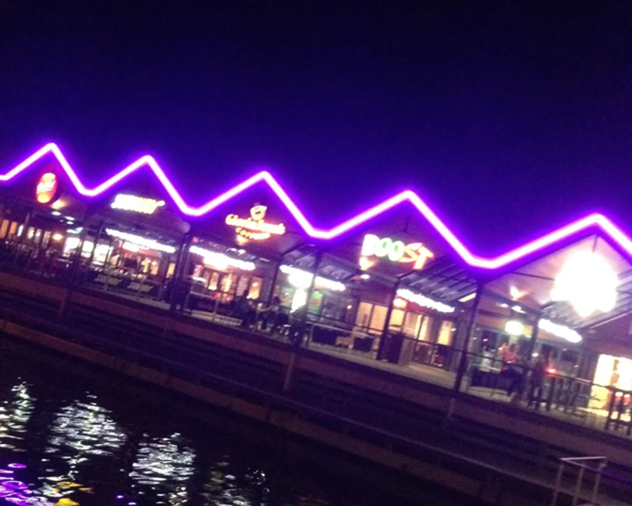 Neon flex strip light bent into a zig-zag across a building facade